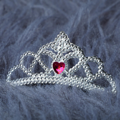 Silver crown with pink heart